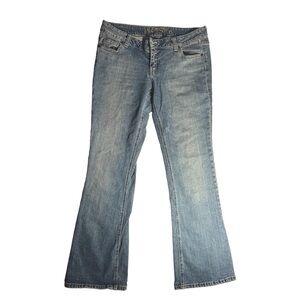 light blue bootcut jeans with a low rise fit.